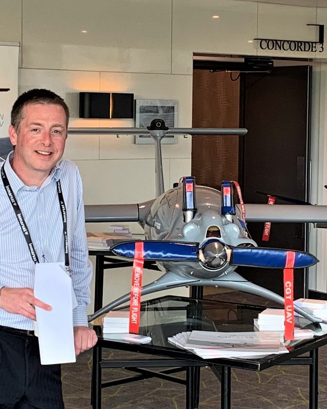 Ian Kiely, founder of Drone Space, beside a fixed-wing VTOL UAV